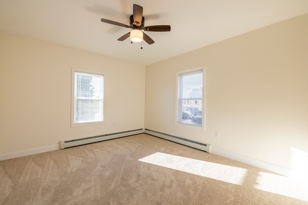15 Rose Street, Unit 2 Haverhill, MA 01830 - Photo 9 of 15 an empty room with a empty space and a ceiling fan