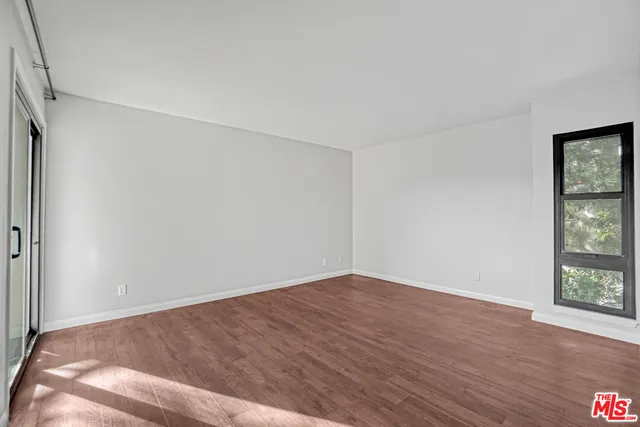 a view of hallway with wooden floor