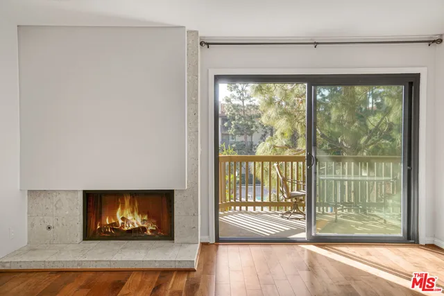 a living room with fireplace furniture and a flat screen tv