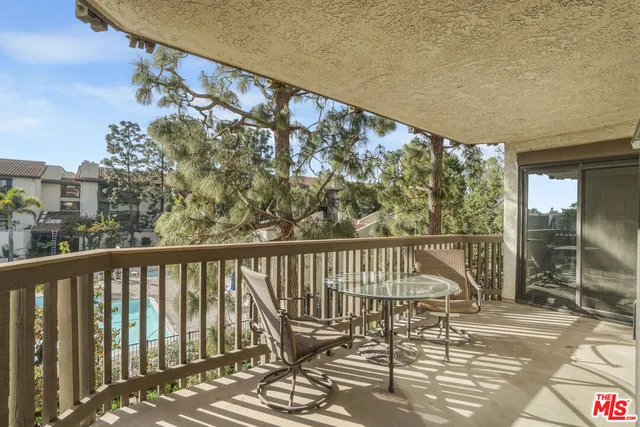 a view of balcony with furniture