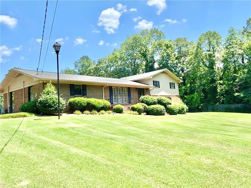 333 Old Freeman Ferry Road Southeast Rome, GA 30161 - Photo 1 of 1 a front view of a house with a yard and garage
