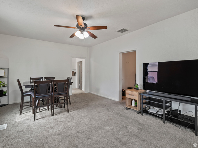 510 Canyon Road Ogden, UT 84404 - Photo 6 of 30 Dining space with light carpet and a ceiling fan
