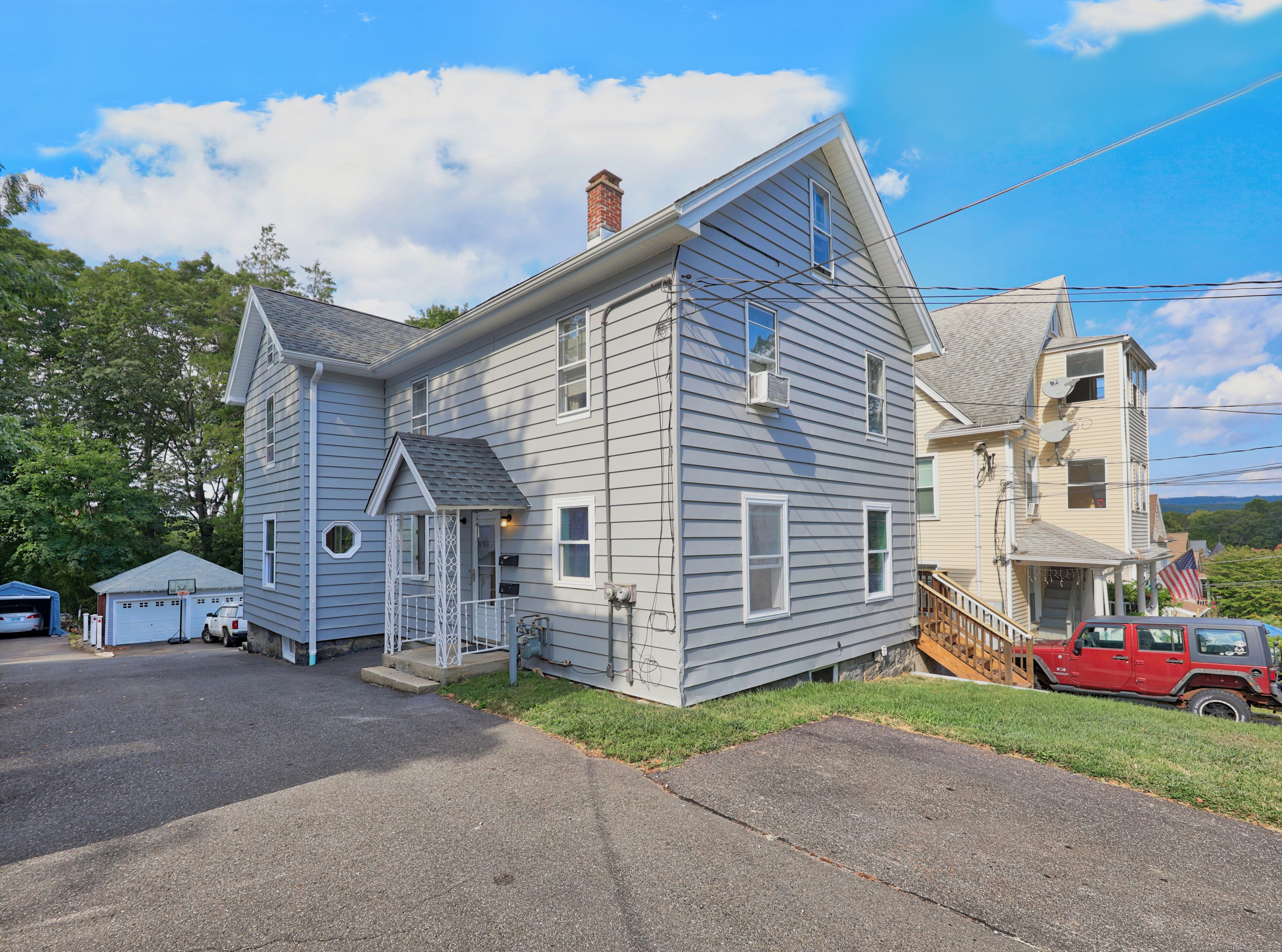 63 New Street Naugatuck, CT 06770 - Photo 1 of 1 a view of a house with a yard and large tree