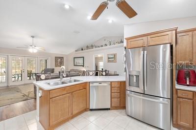 12351 Southwest 73rd Street Ocala, FL 34481 - Photo 18 of 77 a kitchen with a sink refrigerator and cabinets