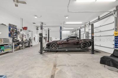 12351 Southwest 73rd Street Ocala, FL 34481 - Photo 5 of 77 a view of a garage with parked cars