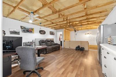 12351 Southwest 73rd Street Ocala, FL 34481 - Photo 55 of 77 a living room with furniture and a flat screen tv