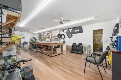 12351 Southwest 73rd Street Ocala, FL 34481 - Photo 58 of 77 a living room with furniture and a wooden floor