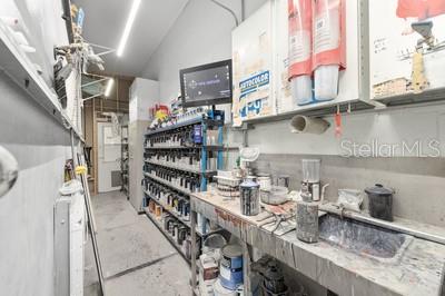 12351 Southwest 73rd Street Ocala, FL 34481 - Photo 67 of 77 a kitchen with stainless steel appliances granite countertop a lot of cabinets and wooden floor