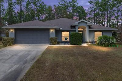 12351 Southwest 73rd Street Ocala, FL 34481 - Photo 75 of 77 a front view of a house with a yard