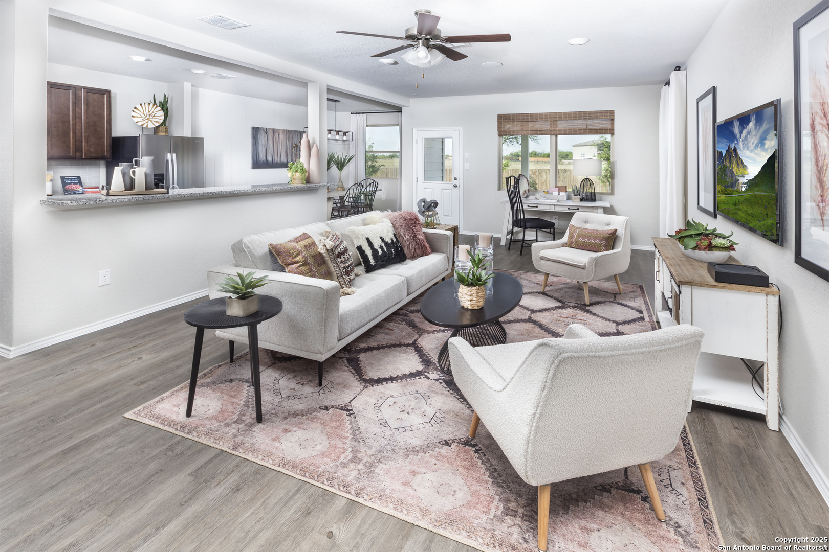 4907 Blue Ranch San Antonio, TX 78222 - Photo 4 of 18 a living room with fireplace furniture and a flat screen tv