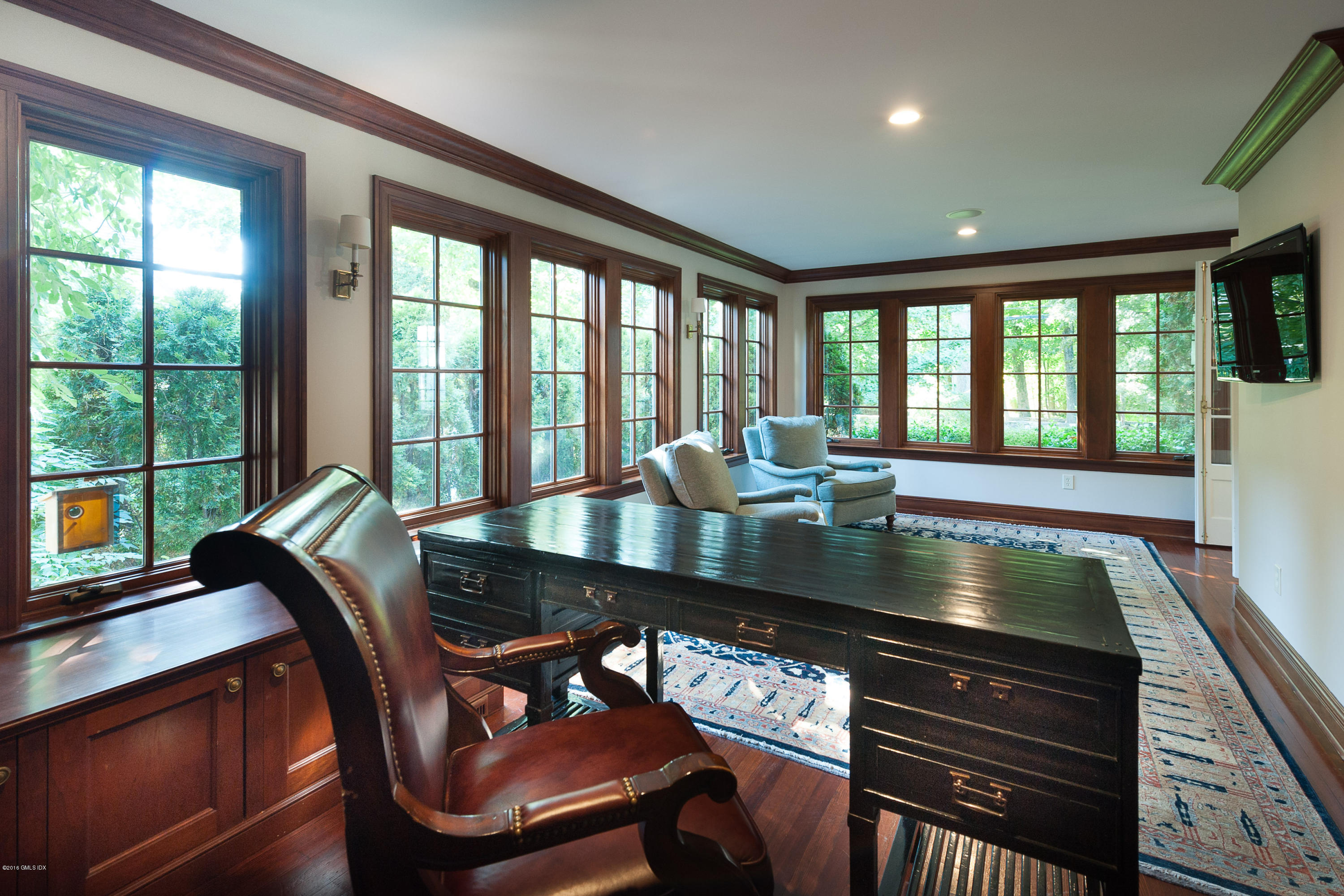 19 Indian Head Road Riverside, CT 06878 - Photo 11 of 34 a view of a dining room with furniture large windows and wooden floor