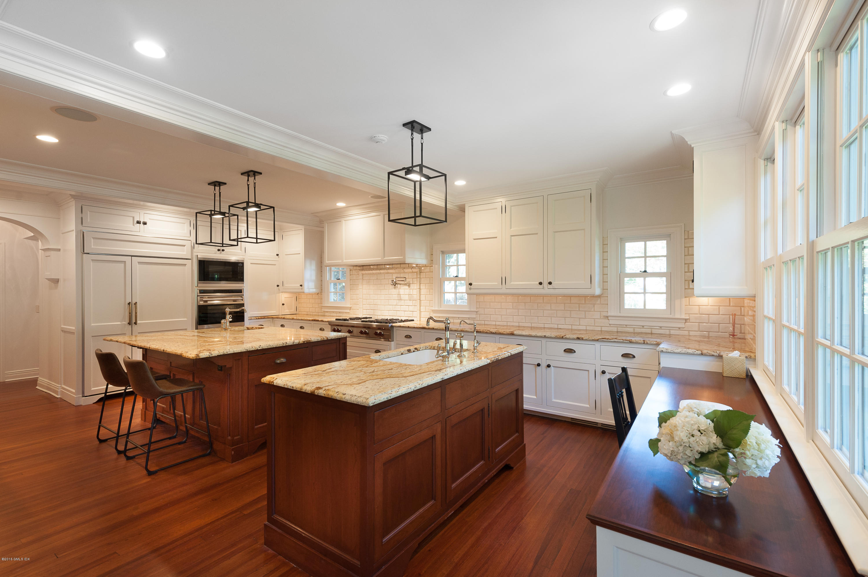 19 Indian Head Road Riverside, CT 06878 - Photo 13 of 34 a large kitchen with kitchen island a sink table and chairs