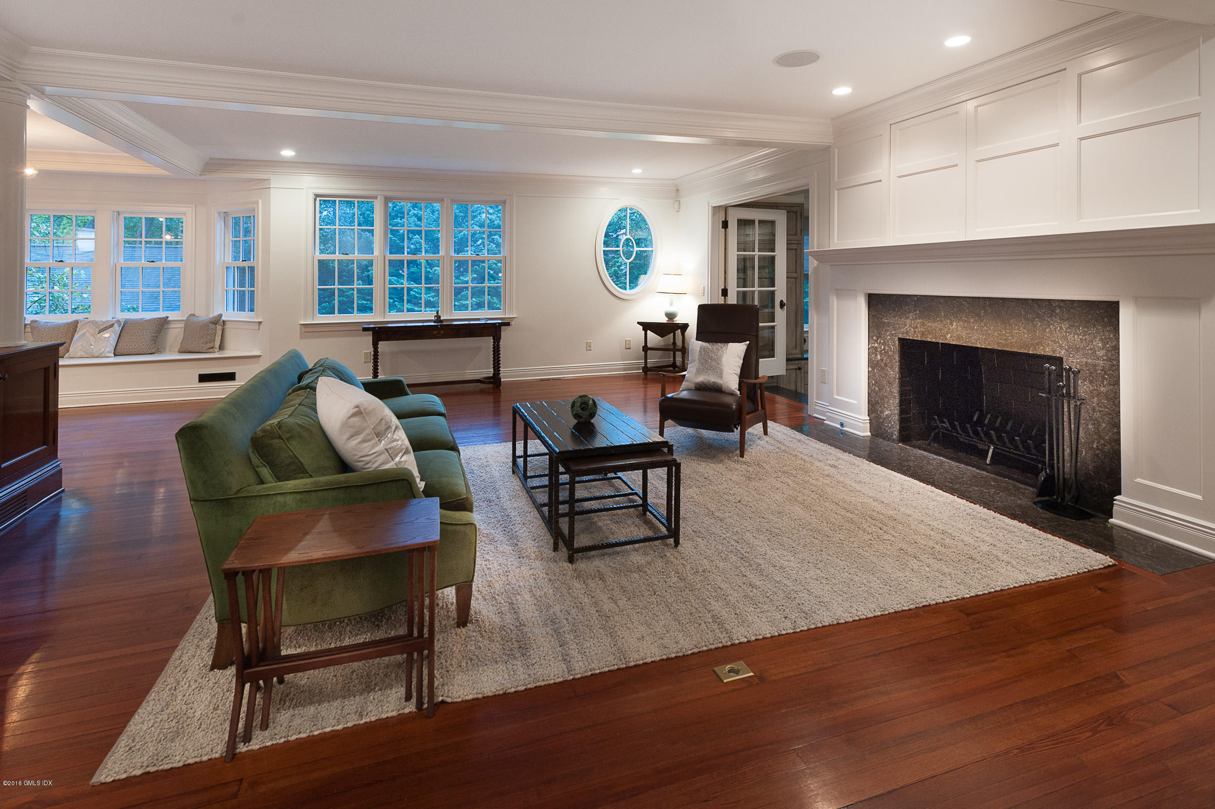 19 Indian Head Road Riverside, CT 06878 - Photo 17 of 34 a living room with furniture and a fireplace
