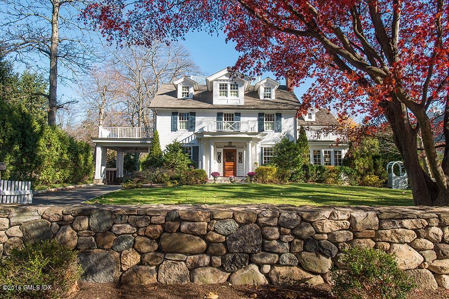 19 Indian Head Road Riverside, CT 06878 - Photo 2 of 34 a front view of a house with a garden