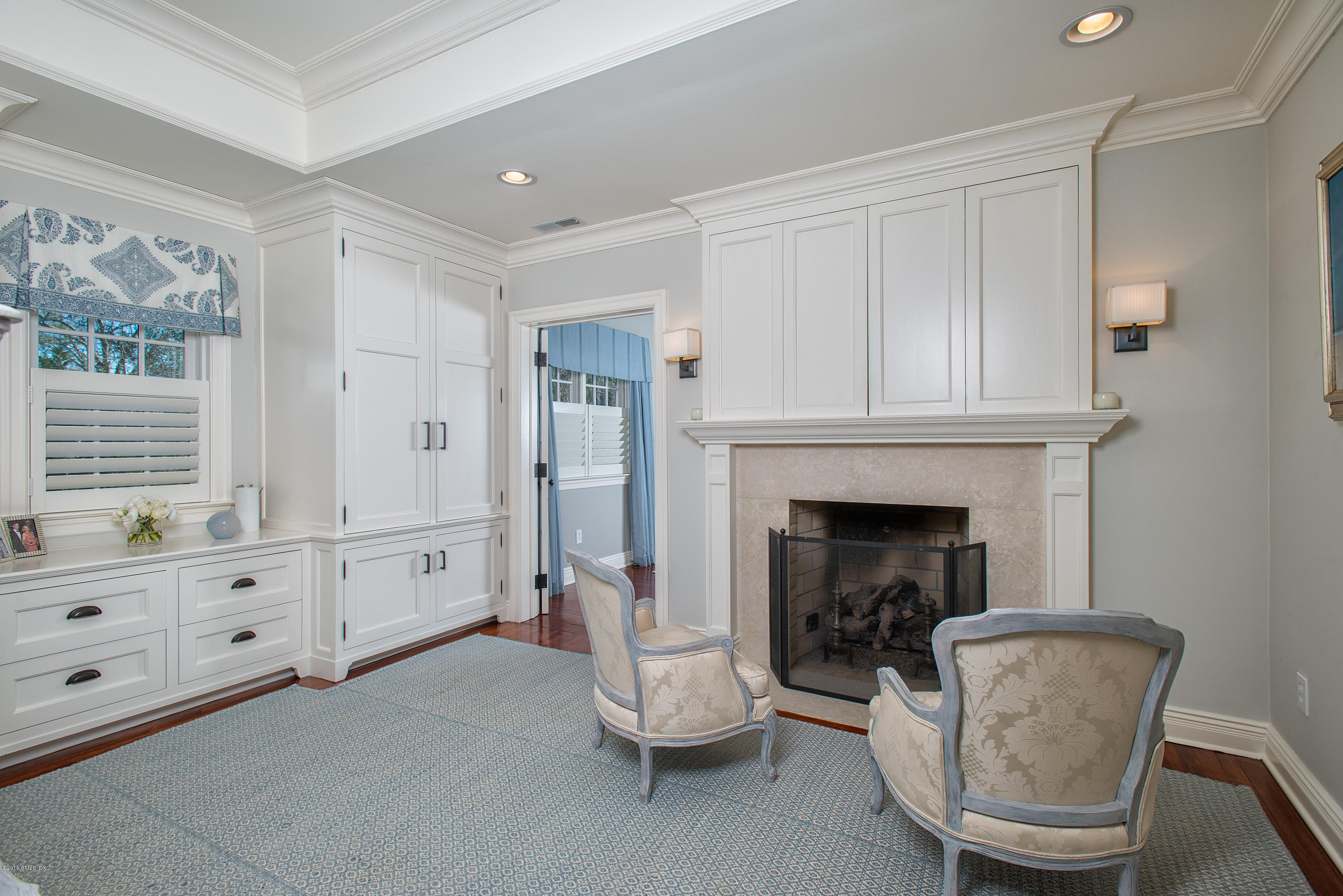 19 Indian Head Road Riverside, CT 06878 - Photo 22 of 34 a living room with furniture and a fireplace
