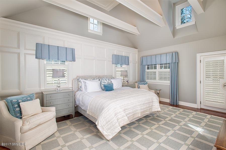 19 Indian Head Road Riverside, CT 06878 - Photo 23 of 34 a bedroom with a large bed and a window