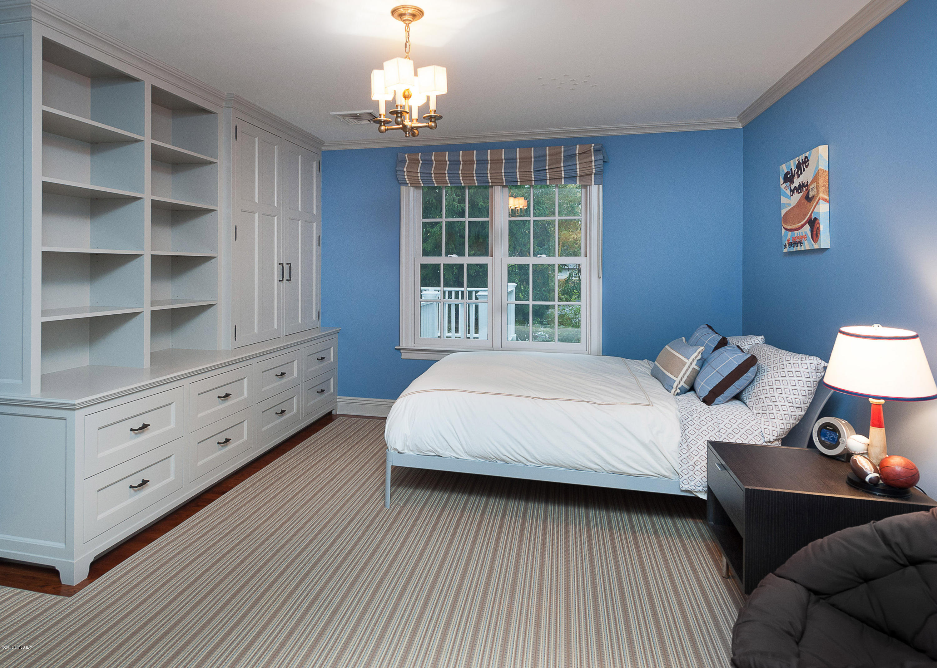 19 Indian Head Road Riverside, CT 06878 - Photo 25 of 34 a spacious bedroom with a bed and a window