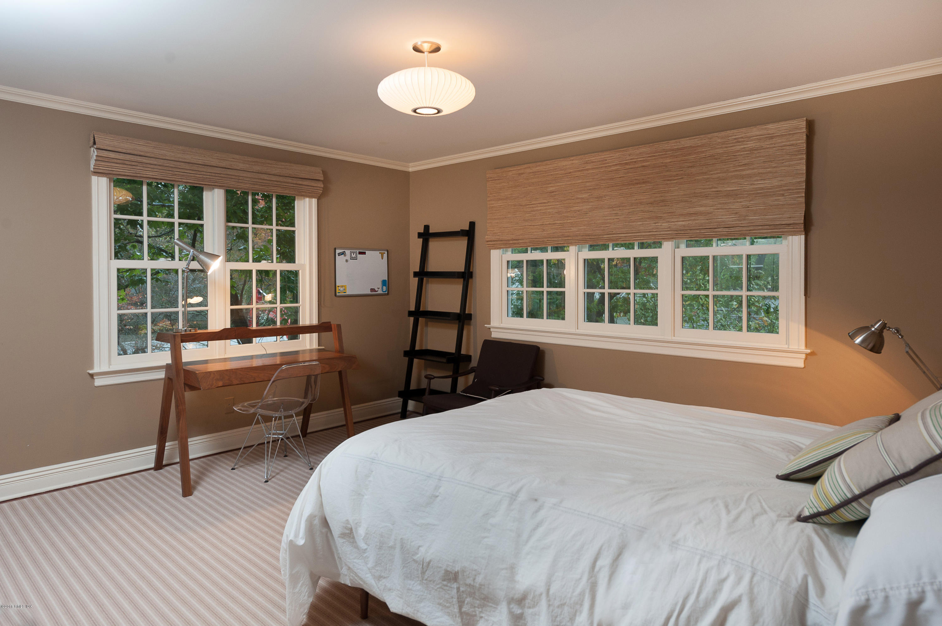 19 Indian Head Road Riverside, CT 06878 - Photo 26 of 34 a bedroom with a bed and a large window