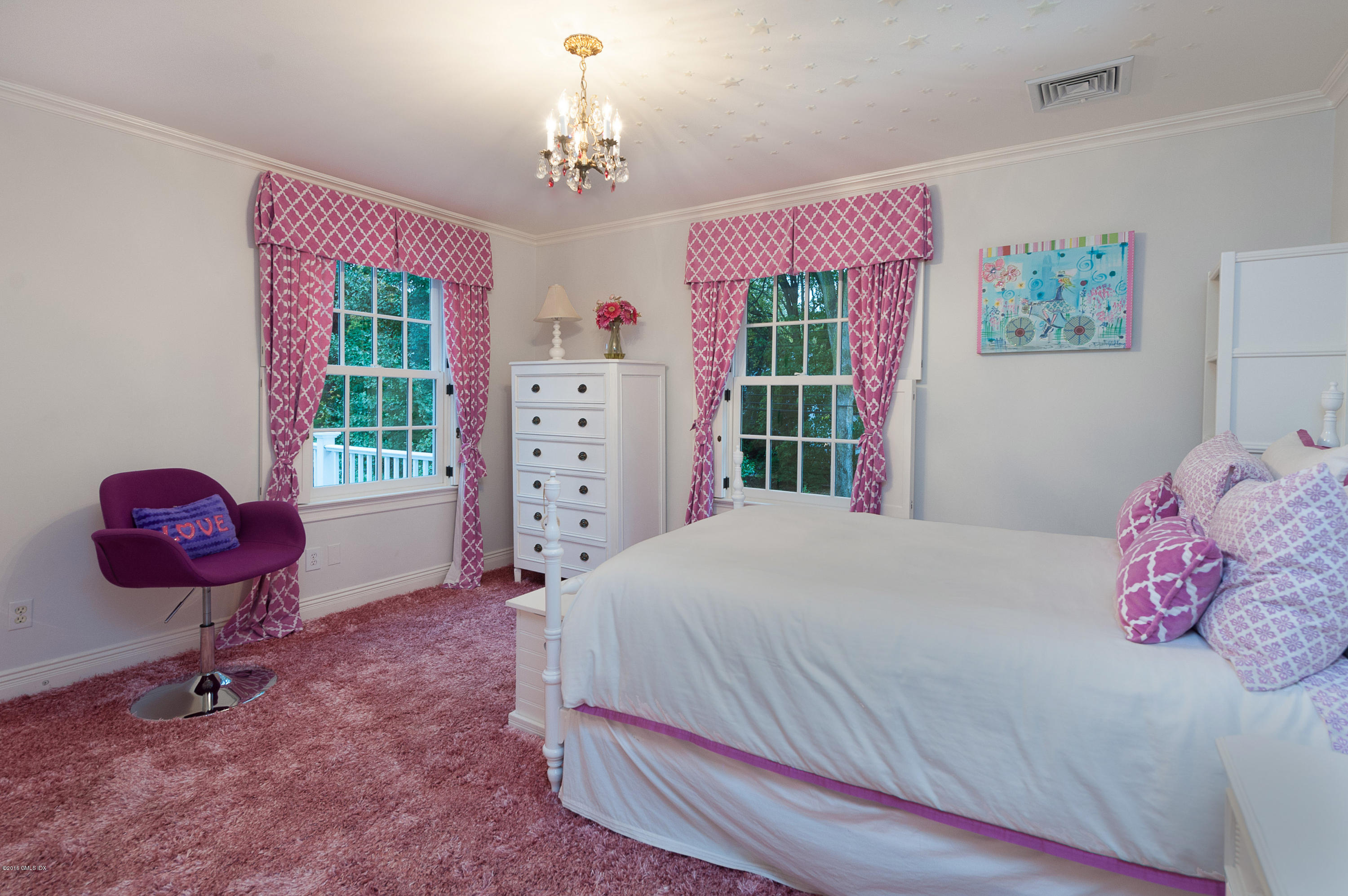 19 Indian Head Road Riverside, CT 06878 - Photo 27 of 34 a bedroom with a bed dresser and a window