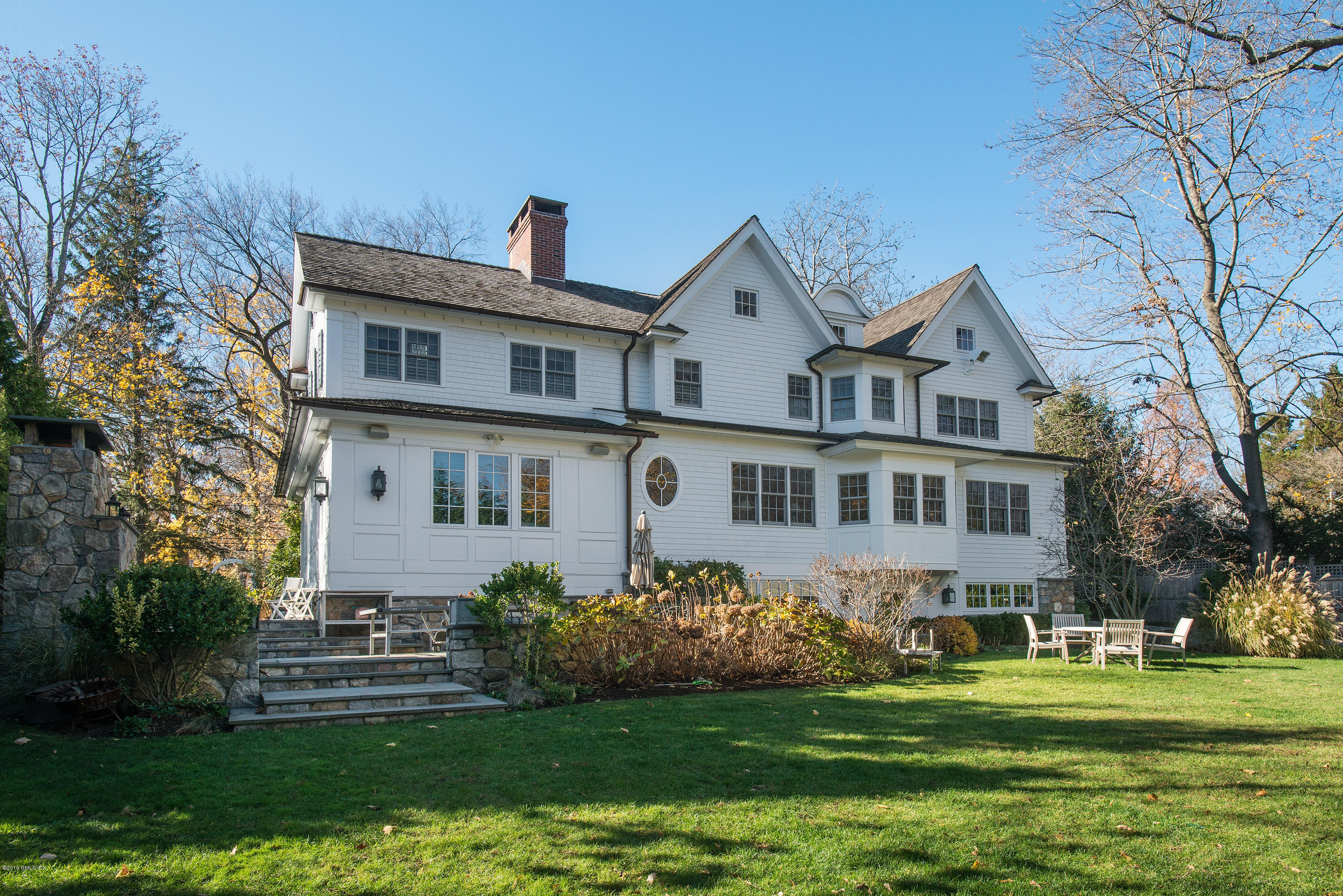 19 Indian Head Road Riverside, CT 06878 - Photo 29 of 34 a front view of a house with a garden