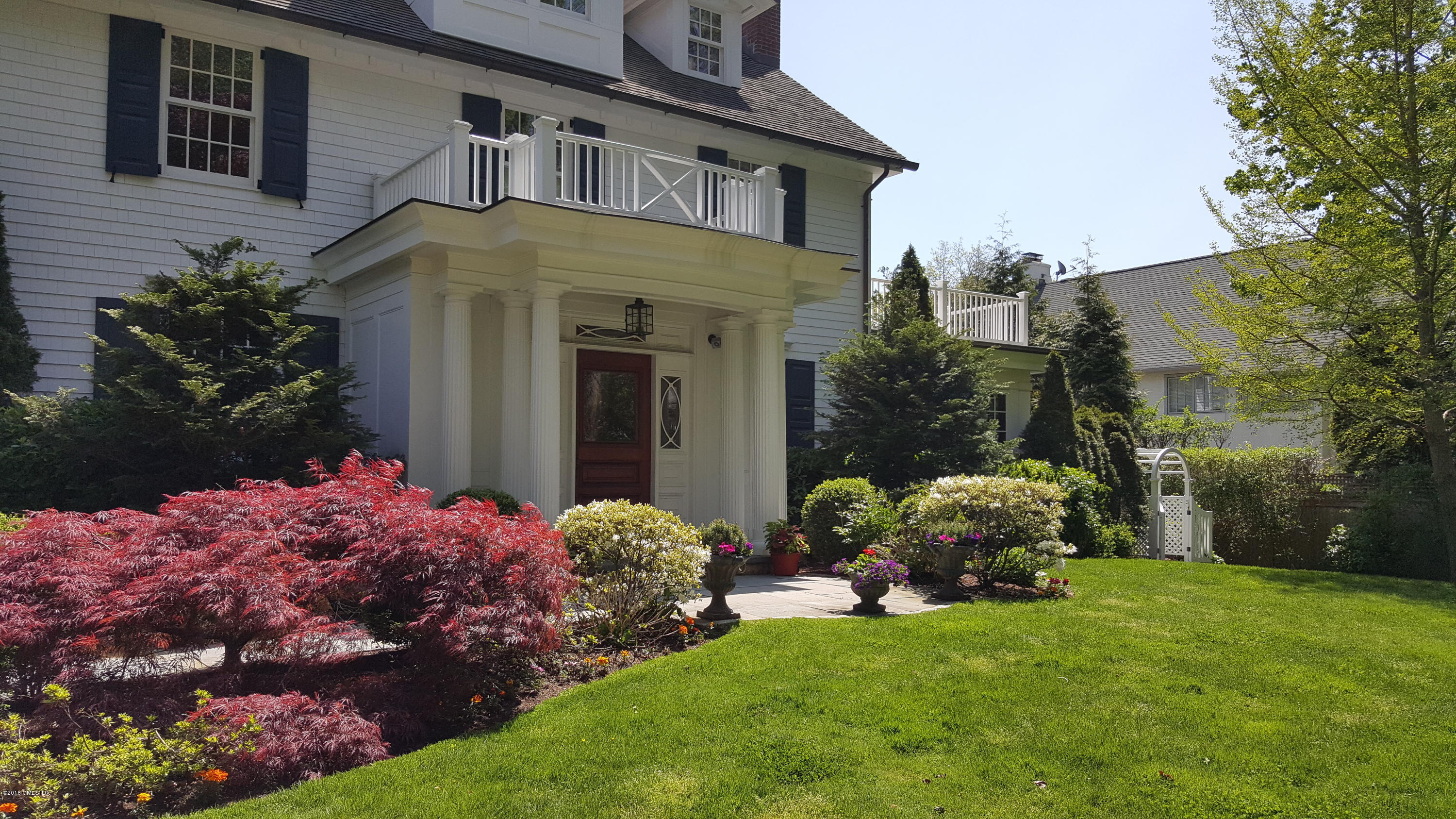19 Indian Head Road Riverside, CT 06878 - Photo 3 of 34 a front view of a house with garden