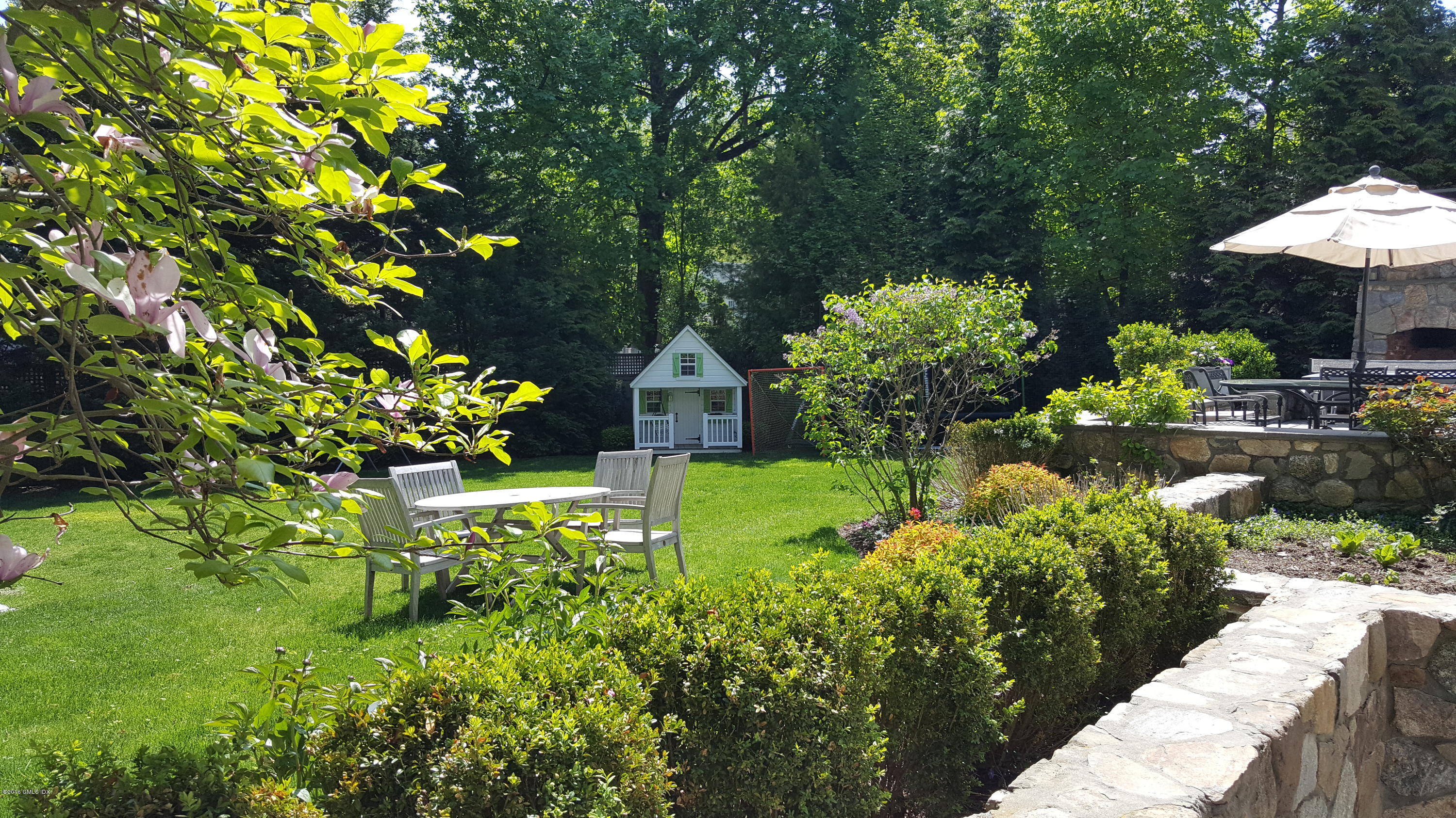 19 Indian Head Road Riverside, CT 06878 - Photo 4 of 34 a view of a garden with plants
