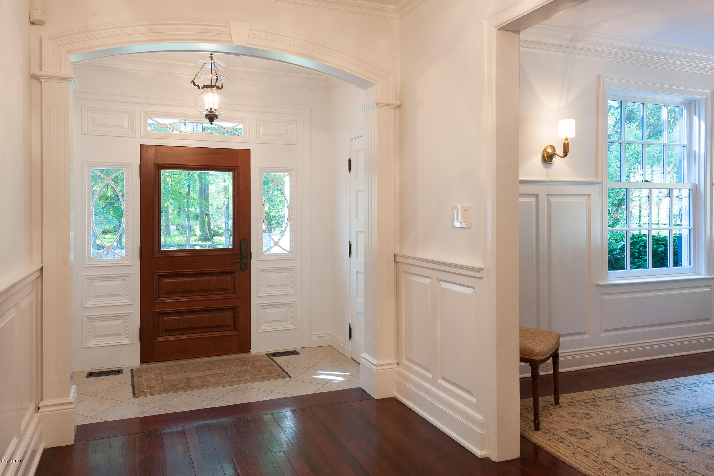 19 Indian Head Road Riverside, CT 06878 - Photo 5 of 34 wooden floor in an entryway with a window