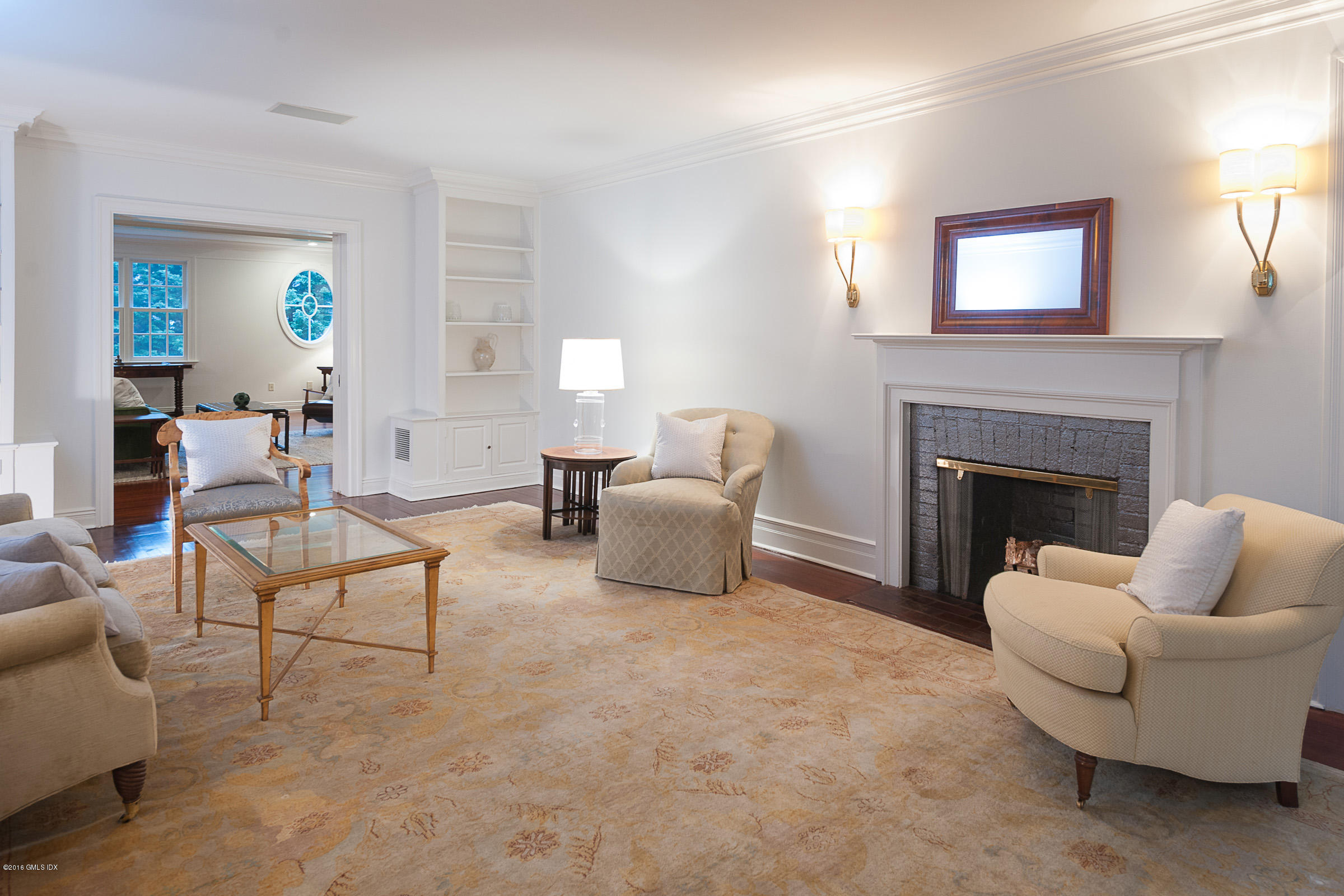 19 Indian Head Road Riverside, CT 06878 - Photo 6 of 34 a living room with furniture and a fireplace