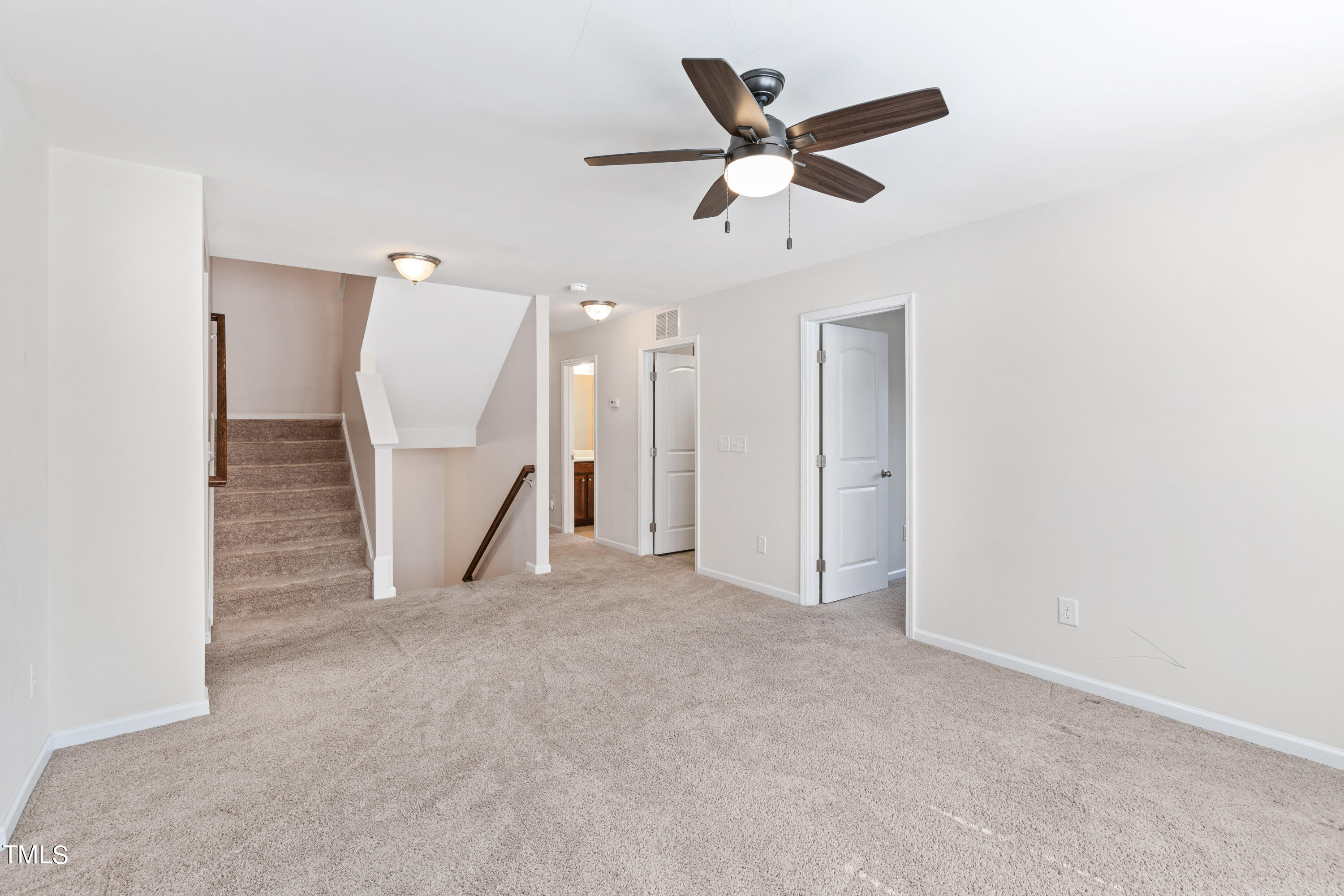 6004 Clapton Drive Wake Forest, NC 27587 - Photo 29 of 52 an empty room with a ceiling fan and a ceiling fan