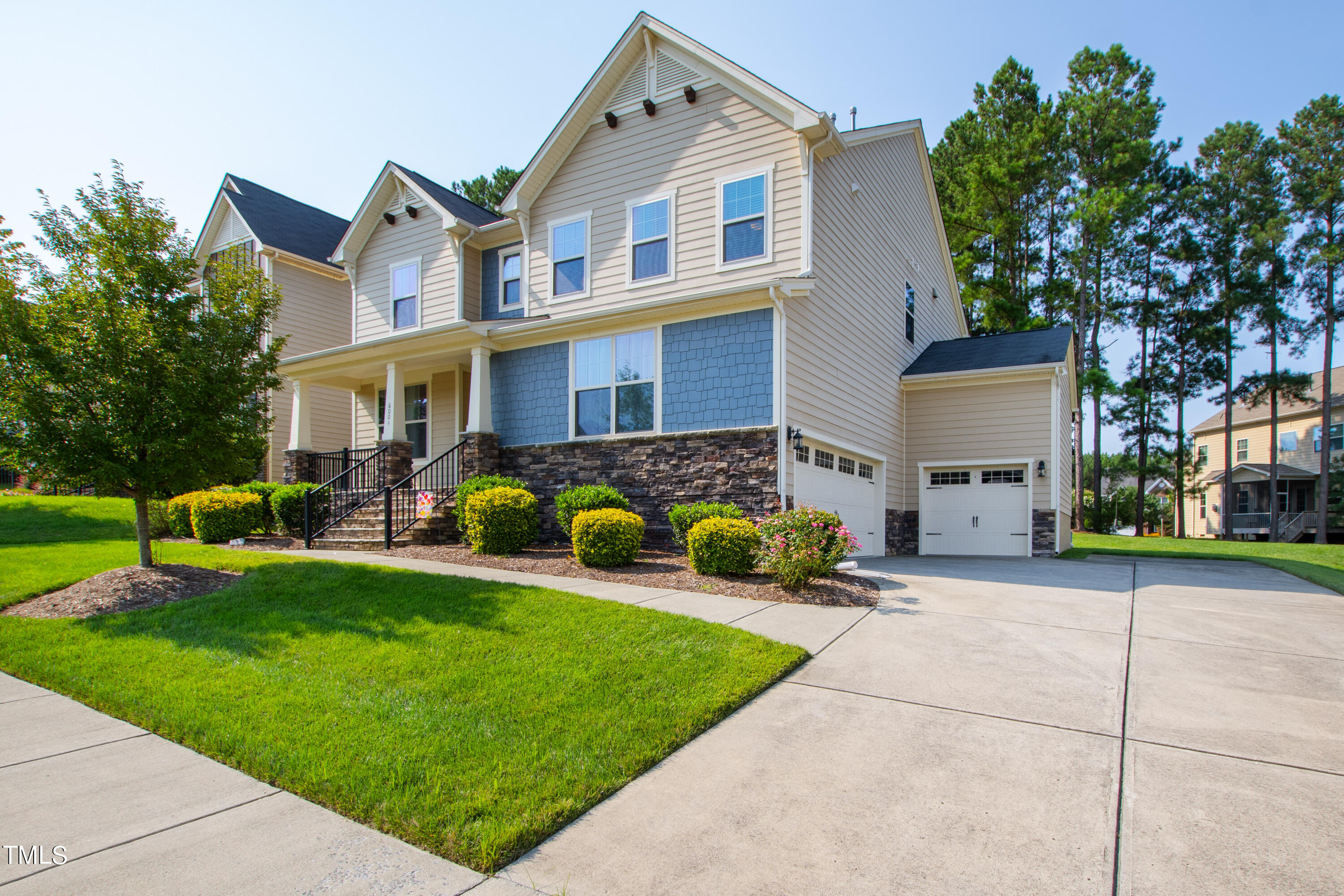 6004 Clapton Drive Wake Forest, NC 27587 - Photo 3 of 52 a front view of a house with garden
