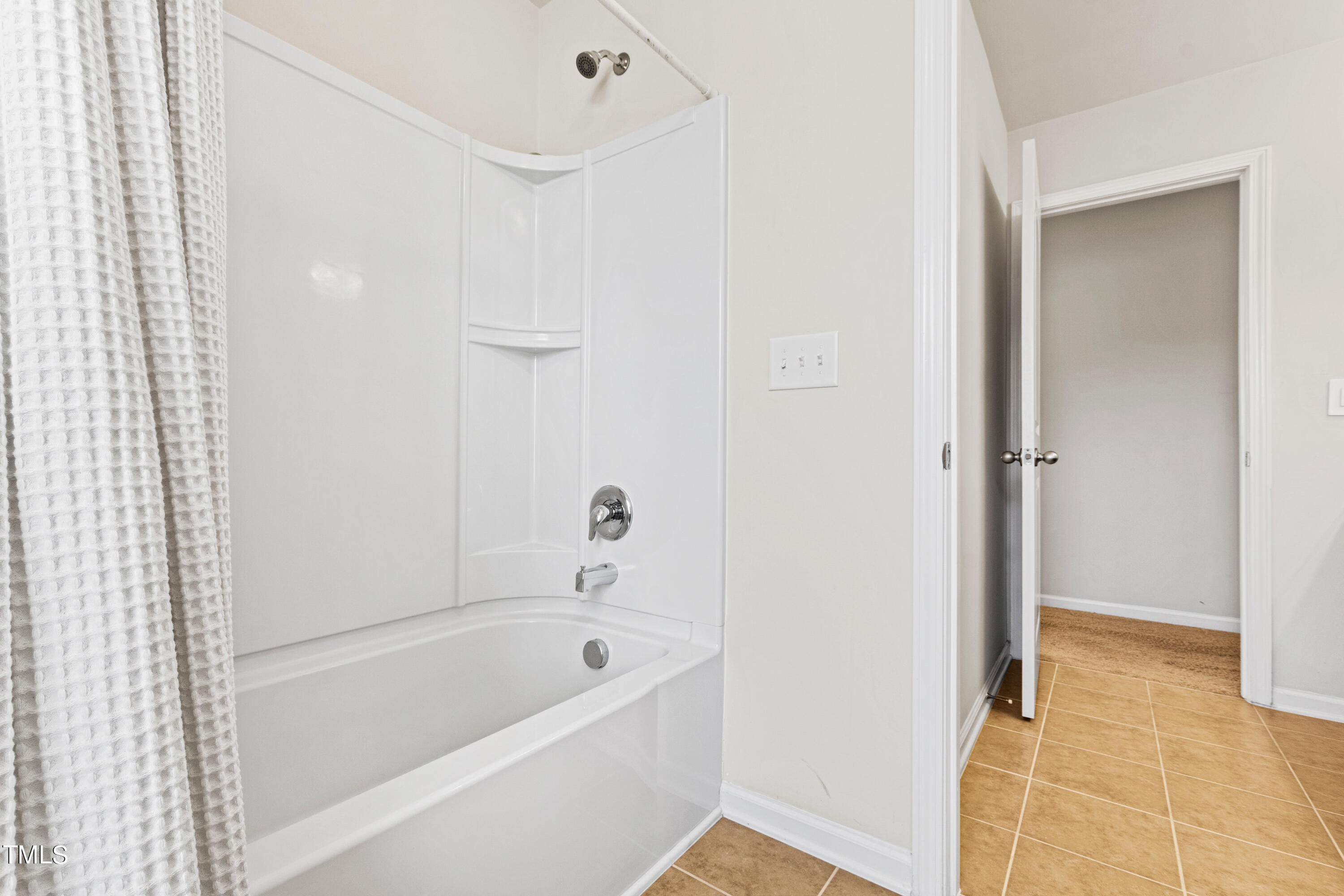 6004 Clapton Drive Wake Forest, NC 27587 - Photo 42 of 52 a bathroom with a bathtub and a shower