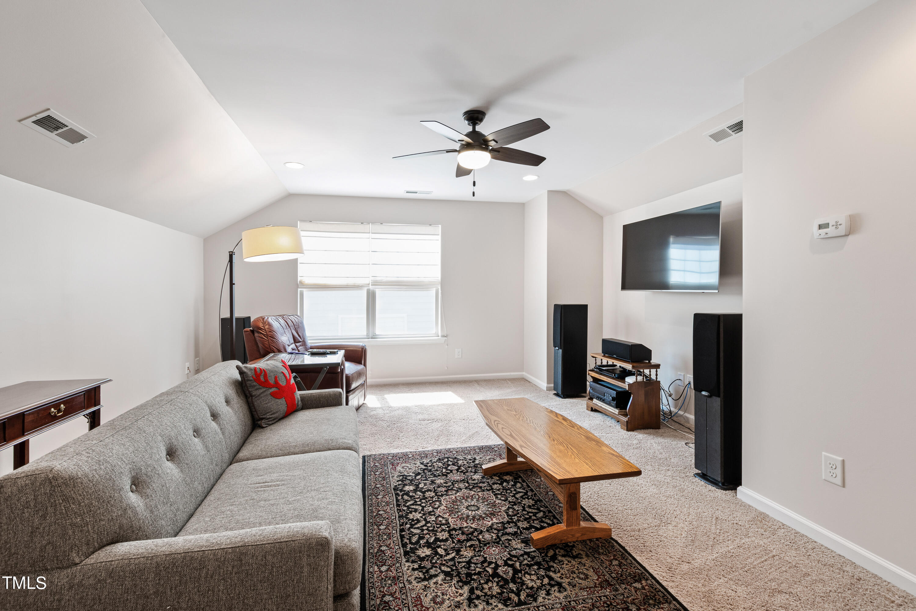 6004 Clapton Drive Wake Forest, NC 27587 - Photo 46 of 52 a living room with furniture and a window