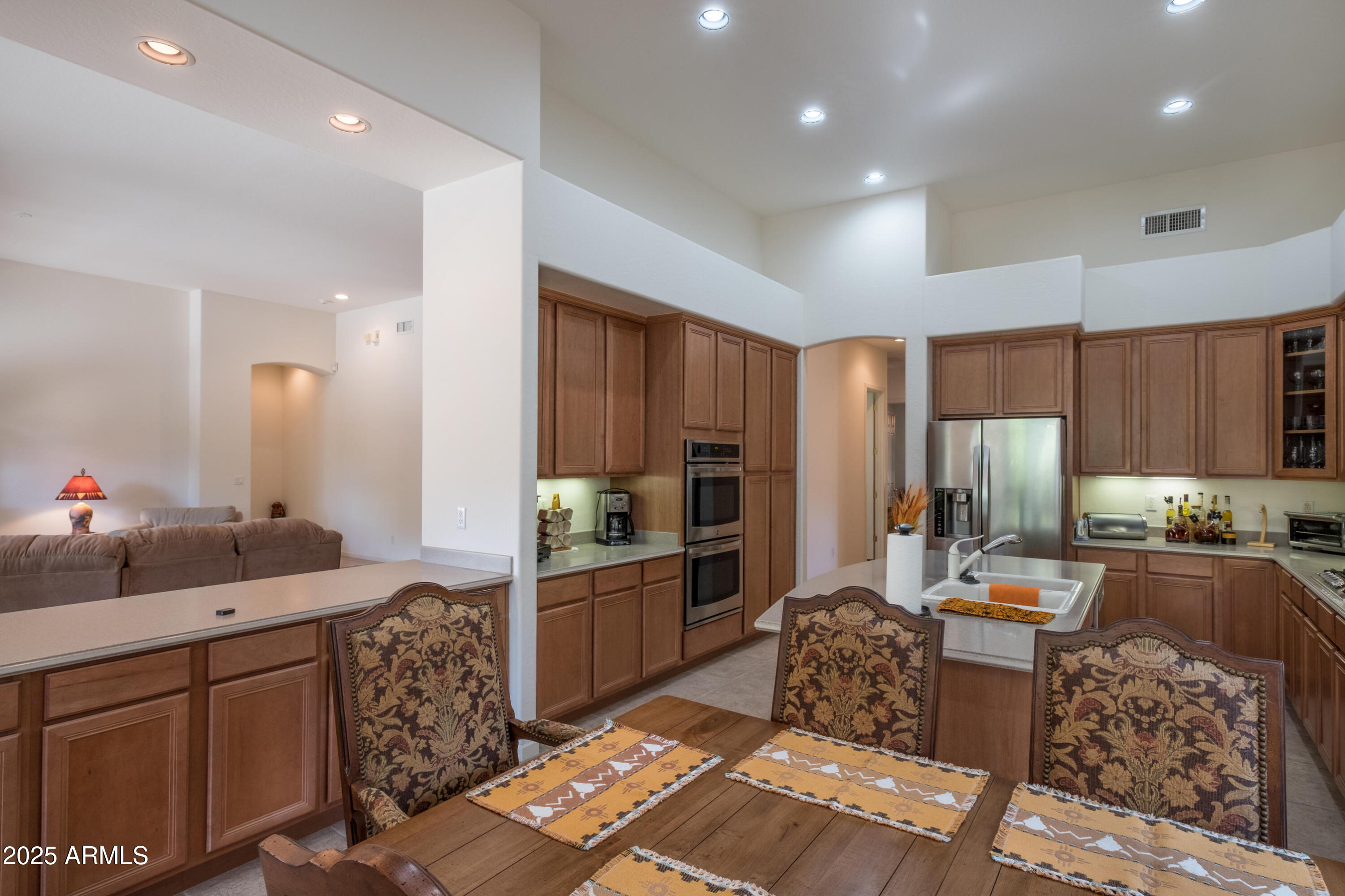 722 Crown Ridge Road Sedona, AZ 86351 - Photo 13 of 35 a kitchen with stainless steel appliances kitchen island granite countertop a sink stove and refrigerator