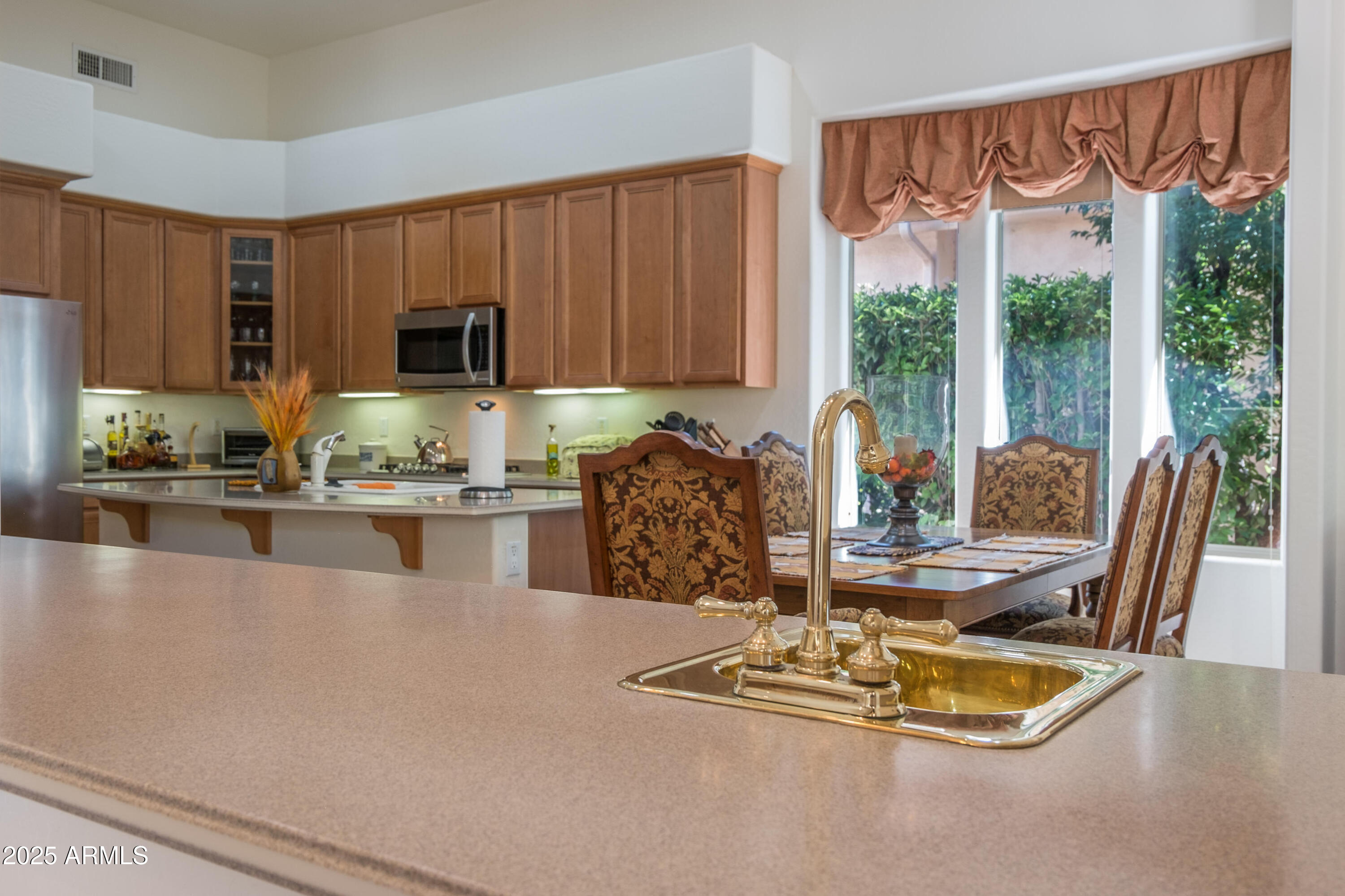 722 Crown Ridge Road Sedona, AZ 86351 - Photo 14 of 35 a dining room with furniture a window and kitchen view