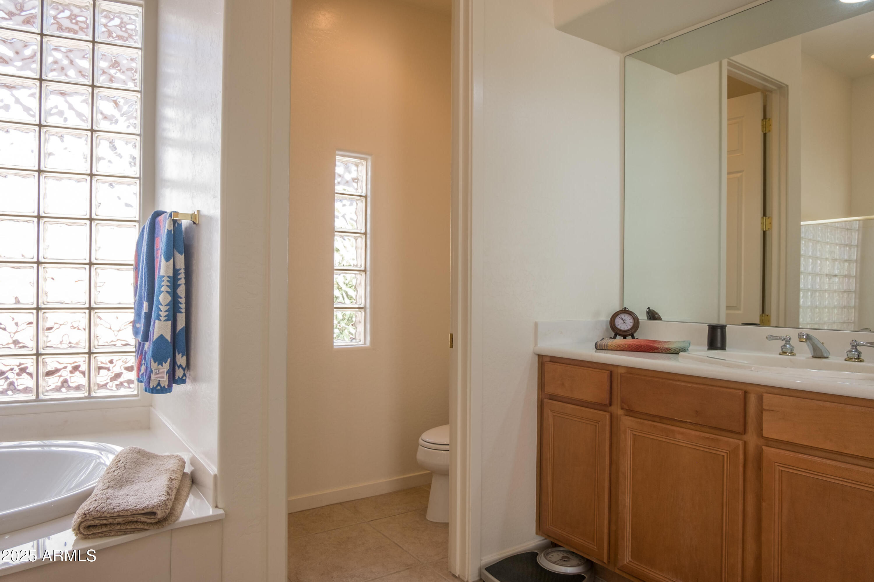 722 Crown Ridge Road Sedona, AZ 86351 - Photo 19 of 35 a bathroom with a sink and a mirror