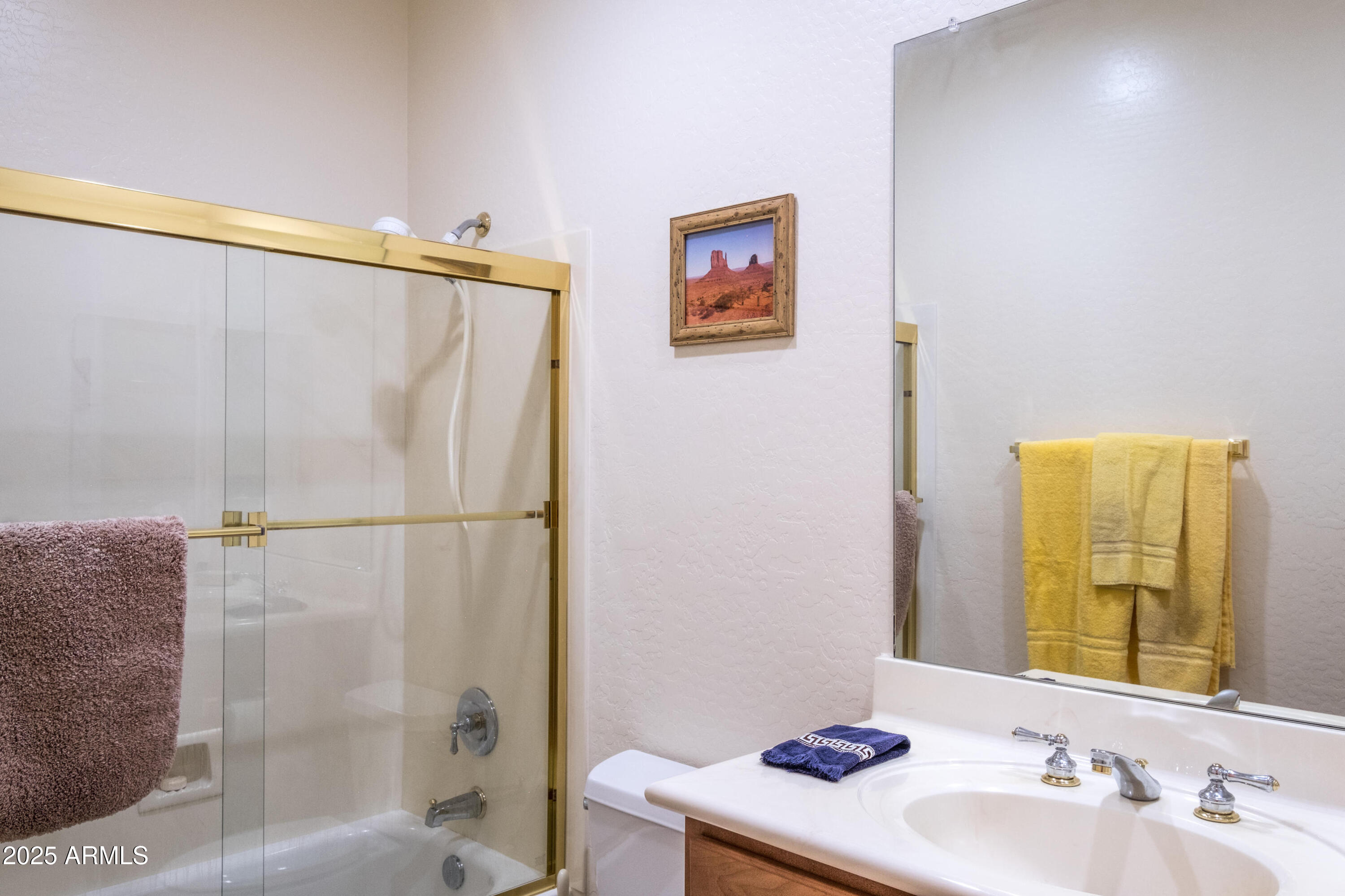 722 Crown Ridge Road Sedona, AZ 86351 - Photo 21 of 35 a bathroom with a sink and a mirror