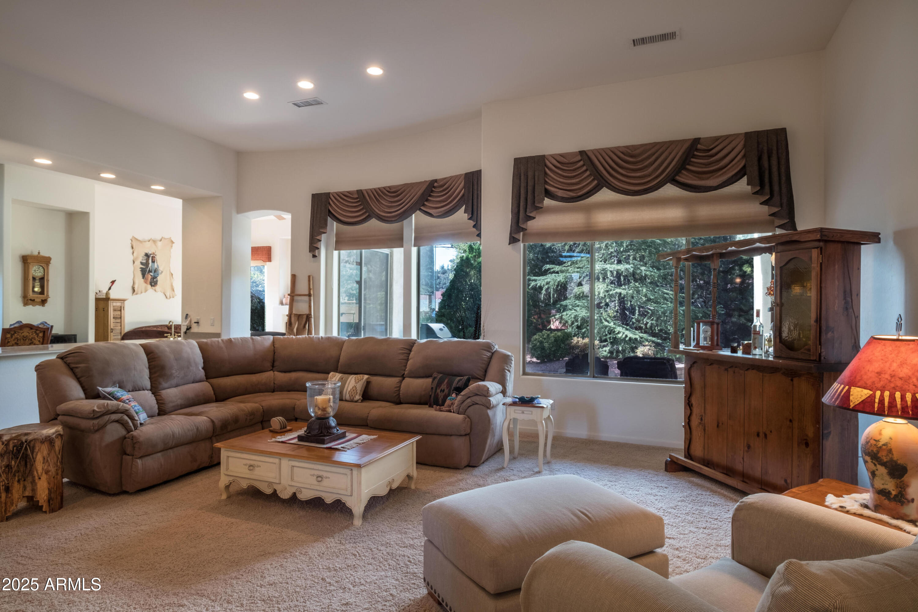 722 Crown Ridge Road Sedona, AZ 86351 - Photo 3 of 35 a living room with furniture and a large window