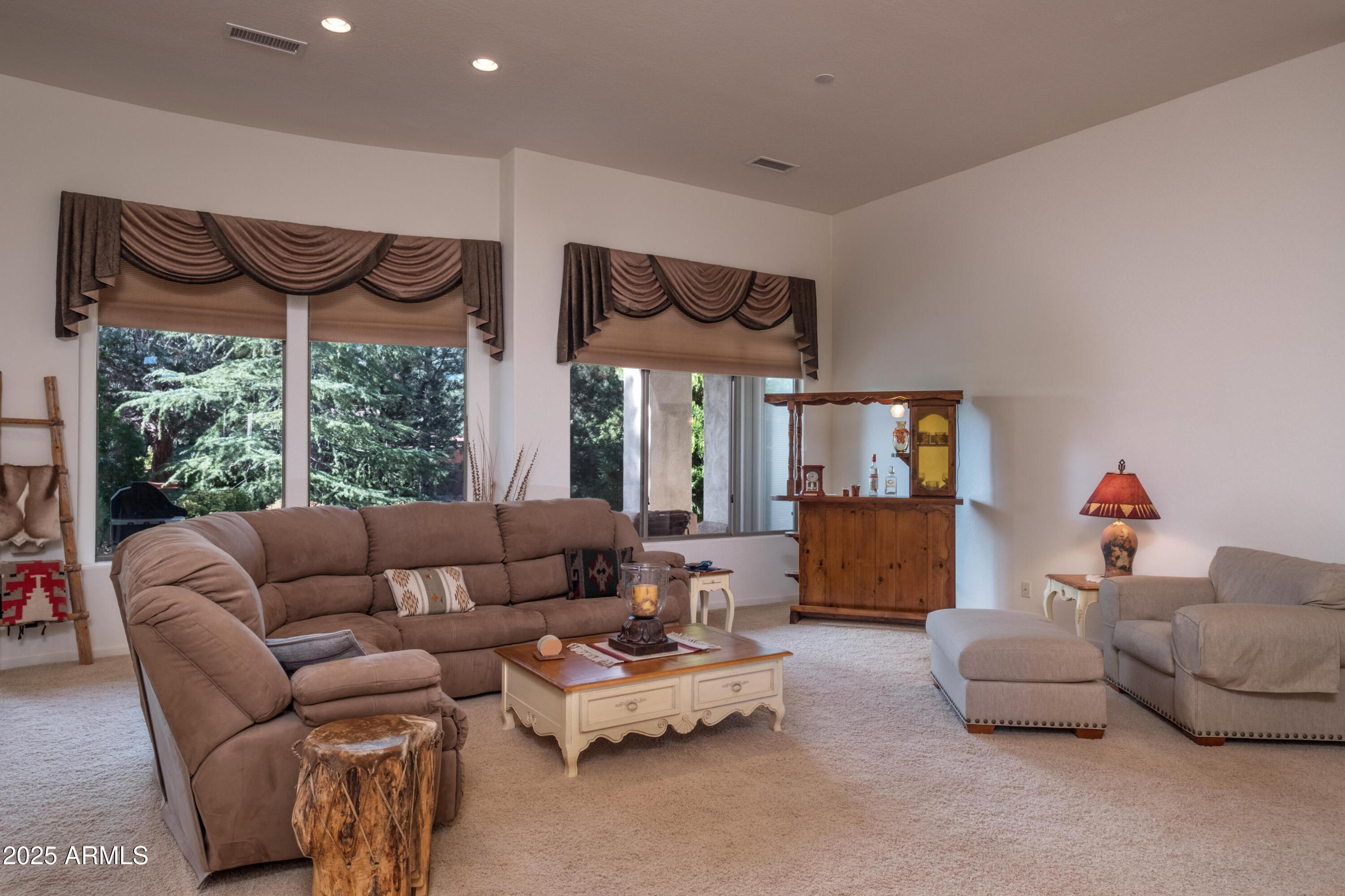 722 Crown Ridge Road Sedona, AZ 86351 - Photo 4 of 35 a living room with furniture and a large window