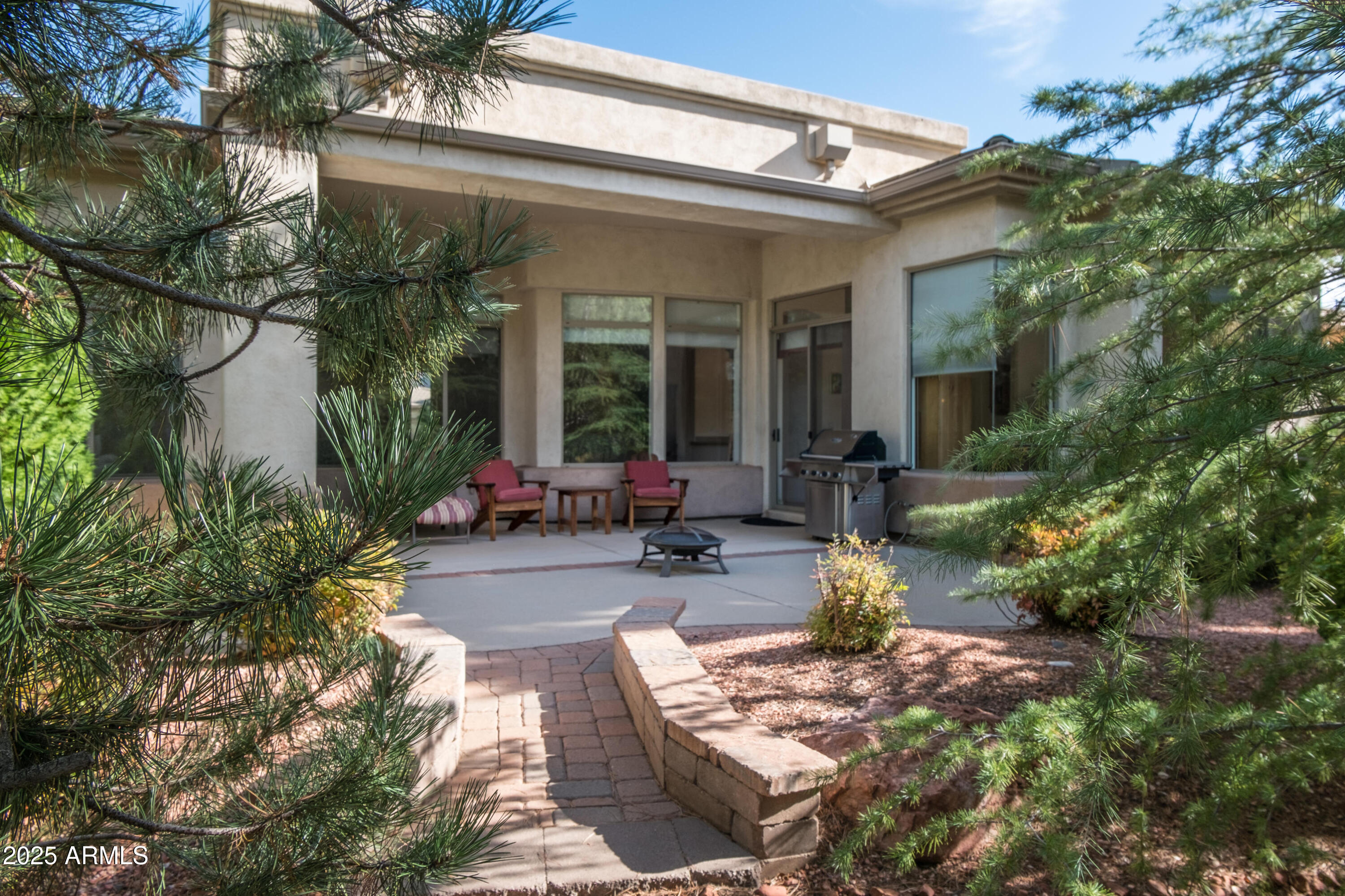 722 Crown Ridge Road Sedona, AZ 86351 - Photo 6 of 35 a view of a patio with couches table and chairs and potted plants