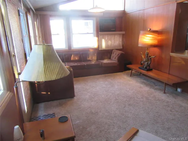 a living room with furniture and a couch
