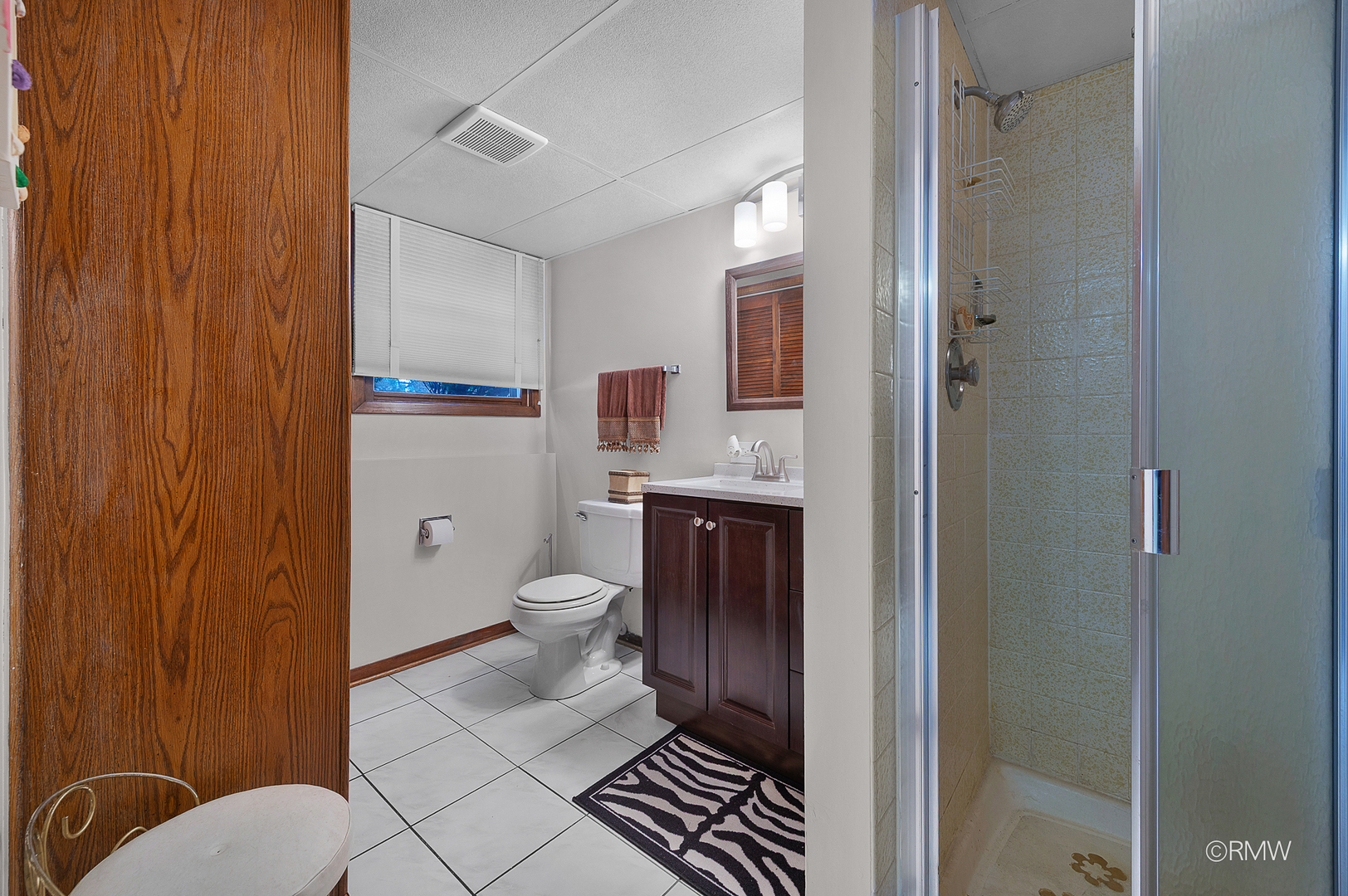 1306 West Byron Avenue Addison, IL 60101 - Photo 11 of 25 a bathroom with a toilet and a shower