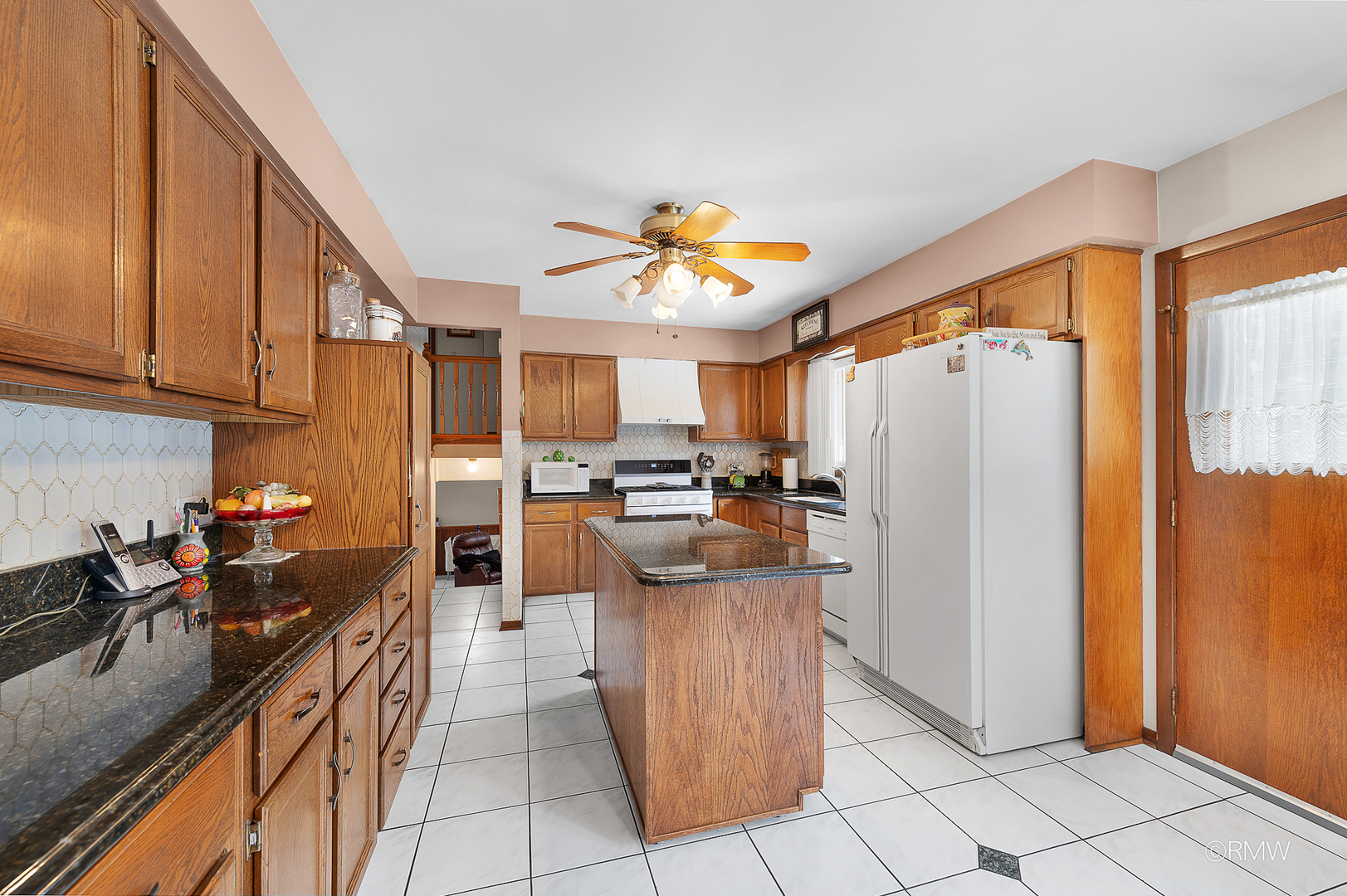 1306 West Byron Avenue Addison, IL 60101 - Photo 19 of 25 a kitchen with refrigerator and cabinets