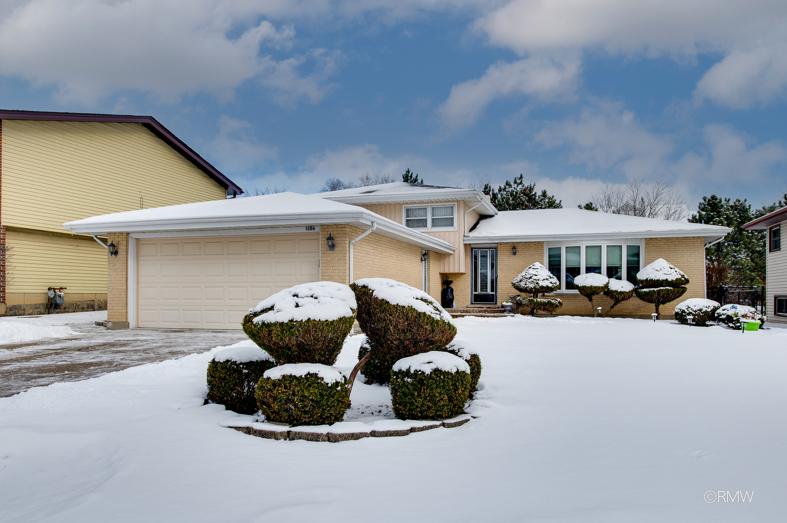 1306 West Byron Avenue Addison, IL 60101 - Photo 3 of 25 a car parked in front of a house