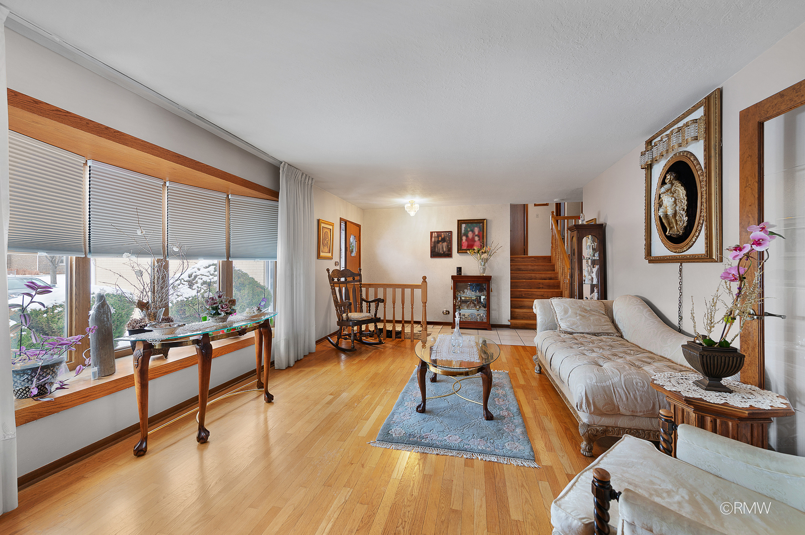 1306 West Byron Avenue Addison, IL 60101 - Photo 6 of 25 a living room with furniture and a floor to ceiling window