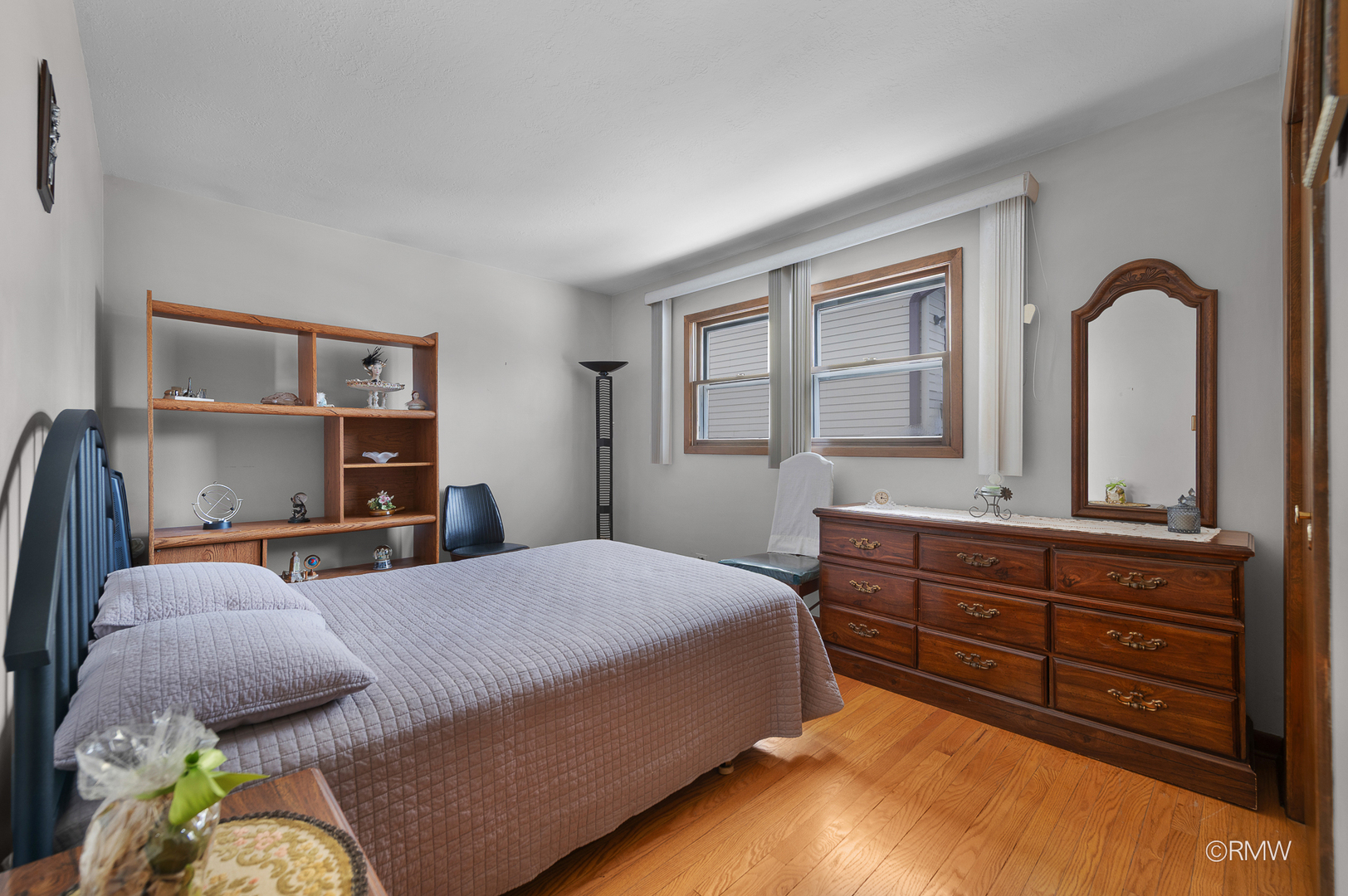 1306 West Byron Avenue Addison, IL 60101 - Photo 10 of 25 a bedroom with a bed and a dresser