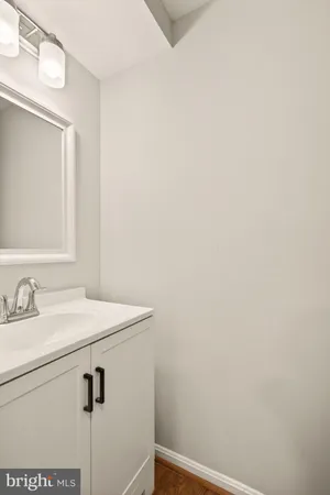 a bathroom with a sink and vanity