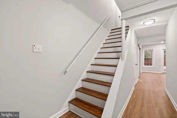 a view of entryway with wooden floor
