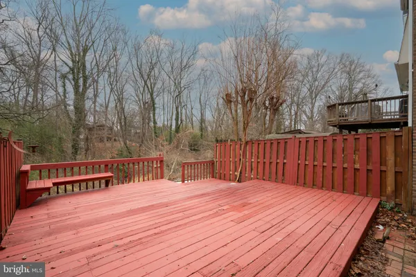 a balcony with wooden floor