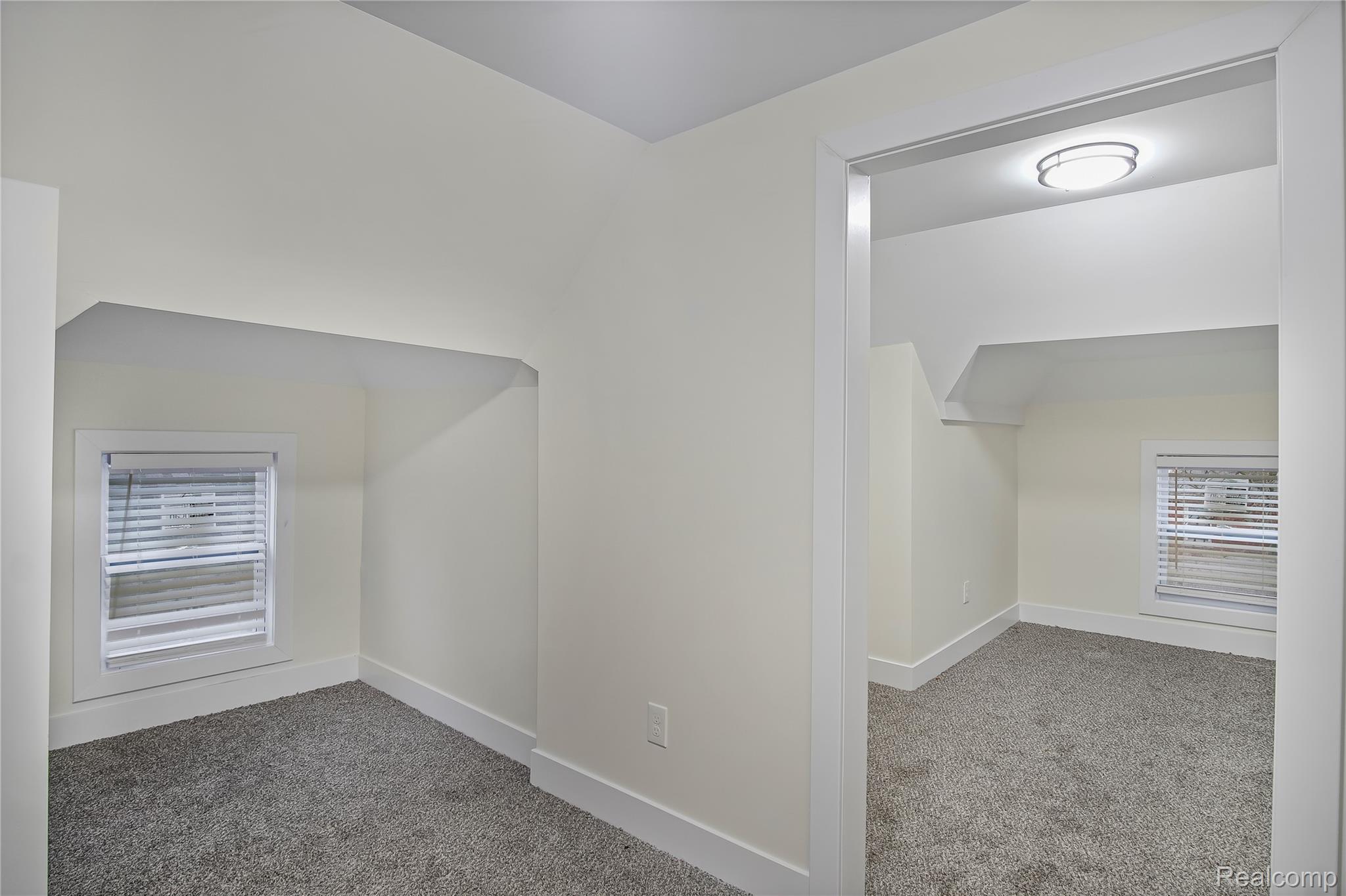 427 Melbourne Street Detroit, MI 48202 - Photo 21 of 29 Additional living space featuring carpet flooring and lofted ceiling