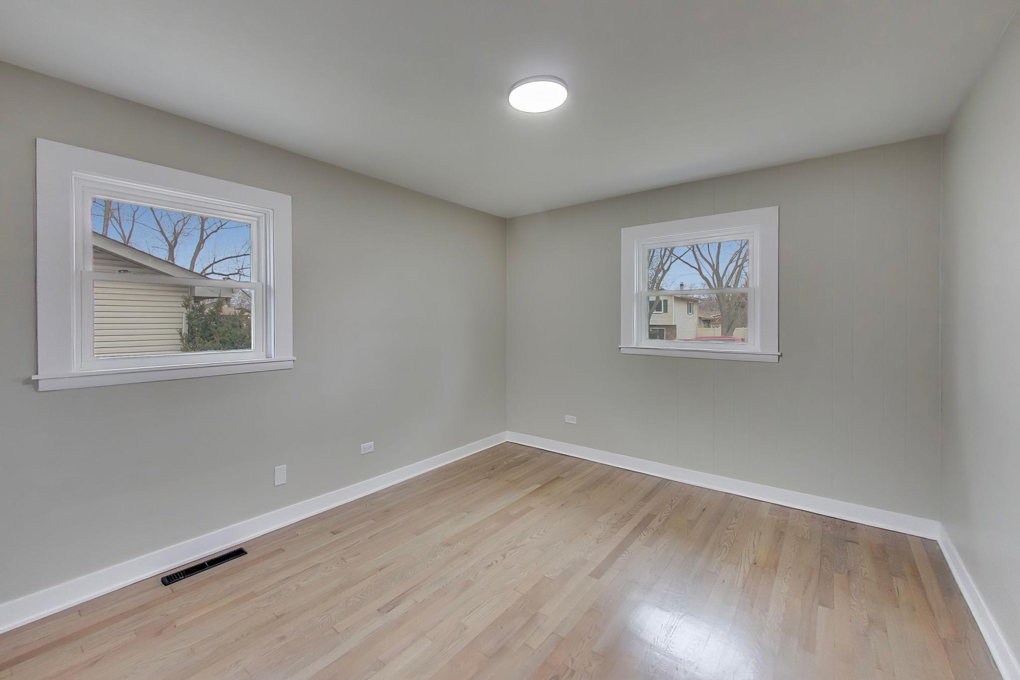 2022 38th Street Highland, IN 46322 - Photo 17 of 41 a view of room with wooden floor and window